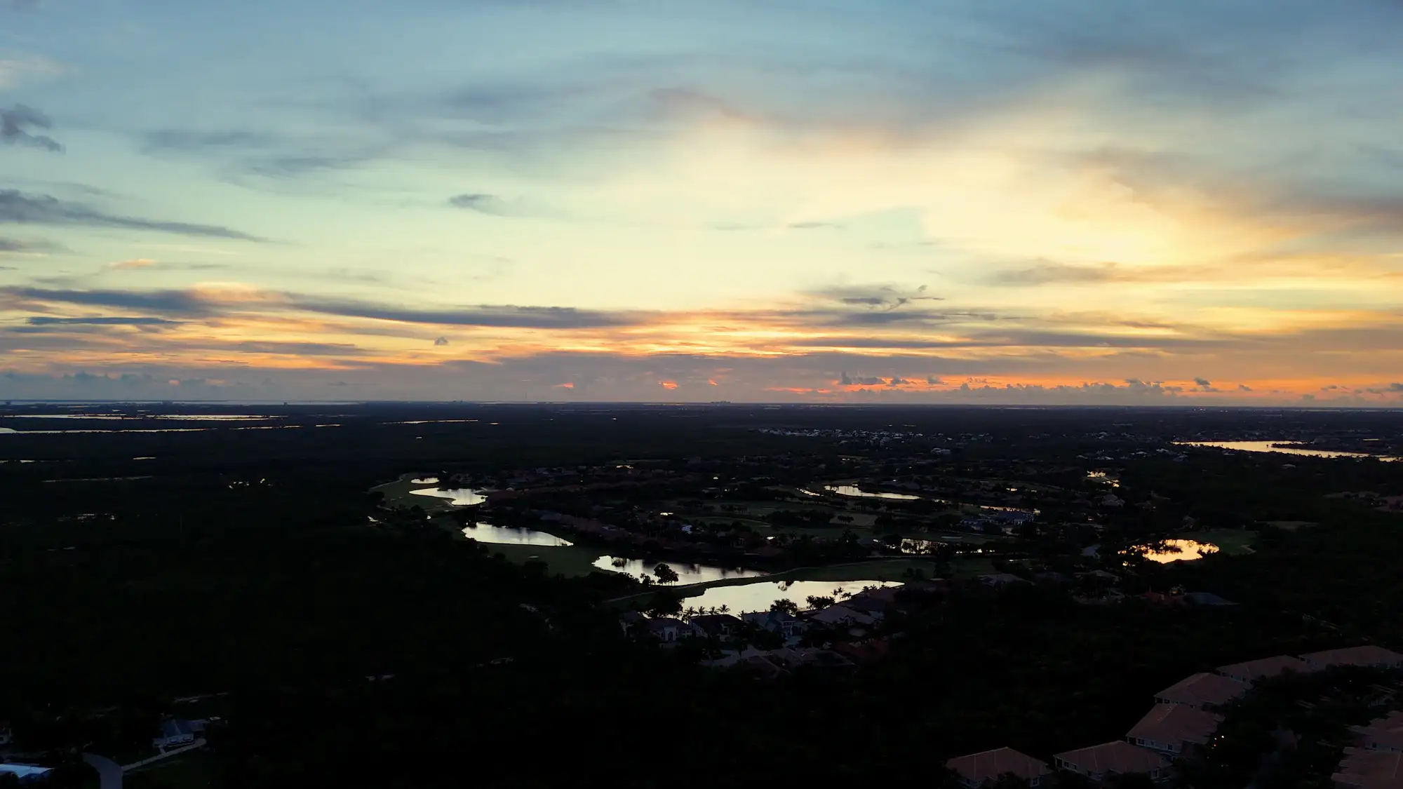 Sunset over golf course communities in Estero, Florida